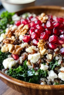Pomegranate, Kale, and Wild Rice Salad with Walnuts and Feta