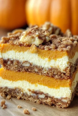 Pumpkin Cheesecake Bars with Walnut Crust and Streusel Topping