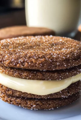 Ginger Molasses Sandwich Cookies with Eggnog Frostings