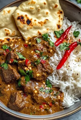 Fiery Beef Coconut Curry with Rice, Garlic Naan & Chili Garnish
