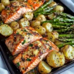 Baked Garlic Salmon with Crispy Baby Potatoes & Cheesy Asparagus